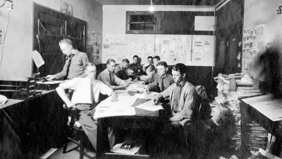 The 1911 Techinque staff in the newsroom.